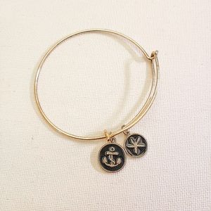 Gold Dangle Bracelet with Black Charms